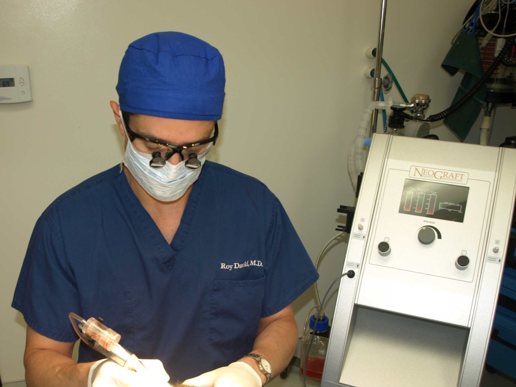 Dr. David working with NeoGraft hair restoration system